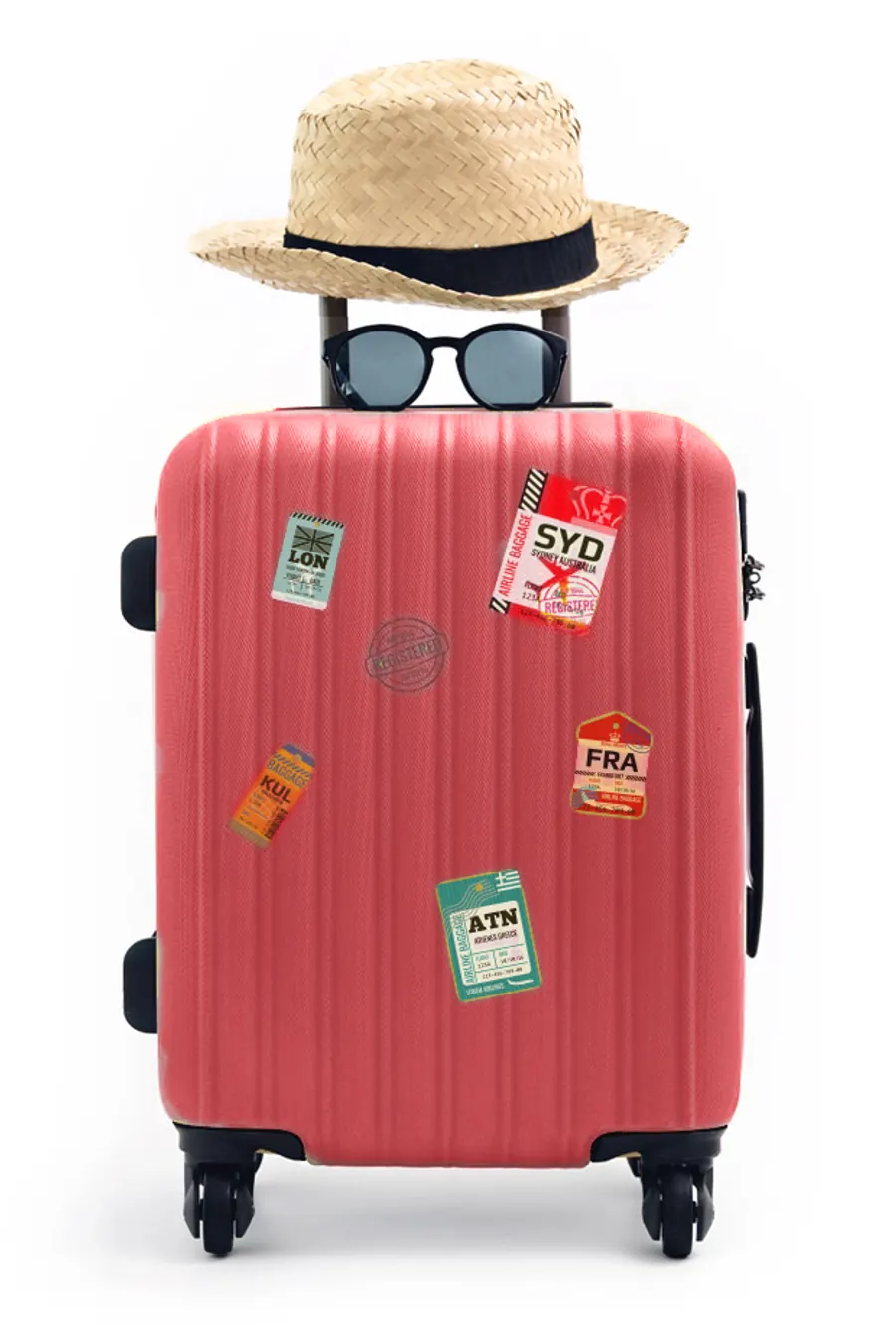 Red suitcase with travel stickers, a straw hat and sunglasses